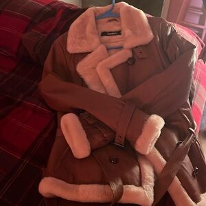 I am selling a brown leather coat size large, no tags, but never worn!￼